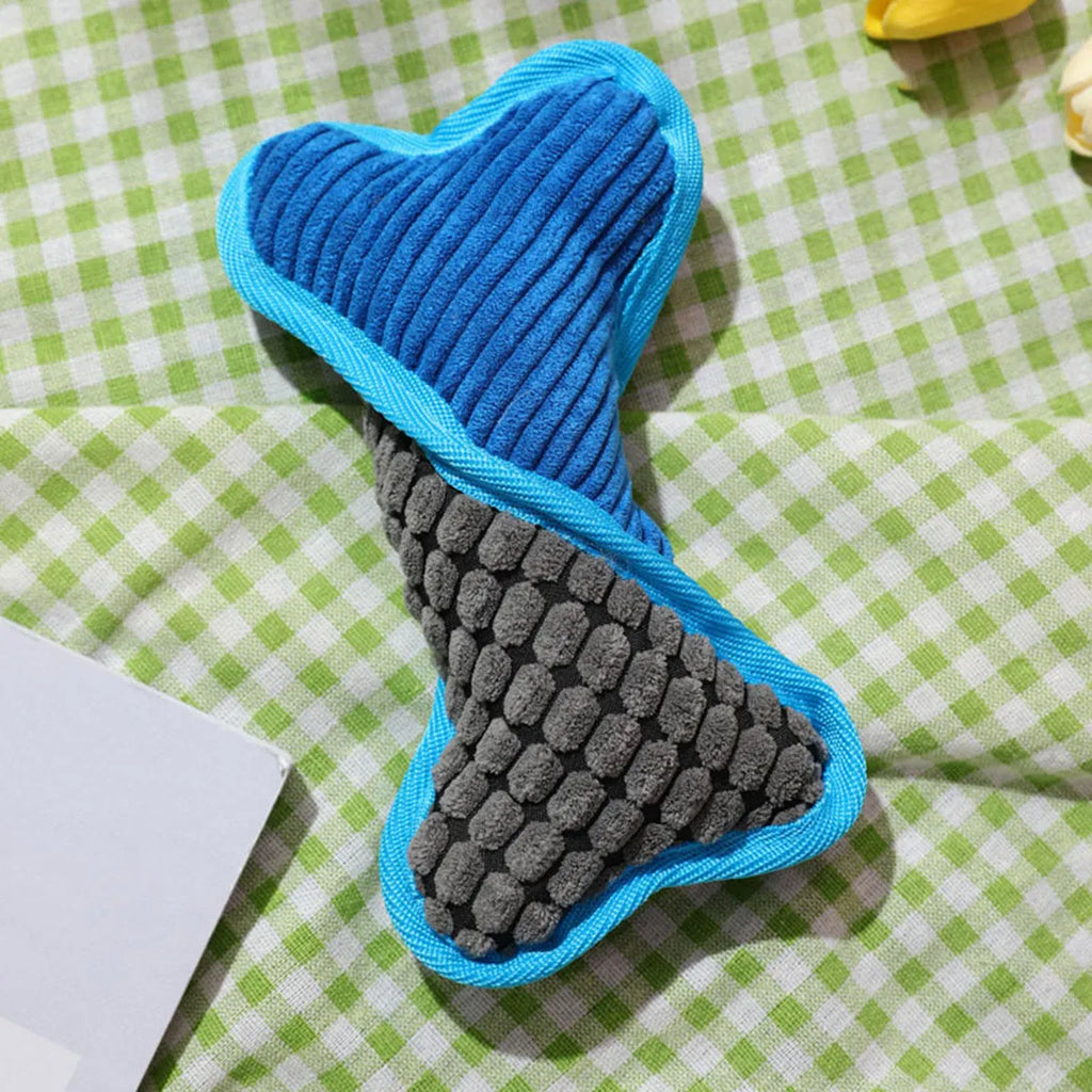 Blue, green, and pink plush dog bone toys with squeakers and soft corn fleece lining.