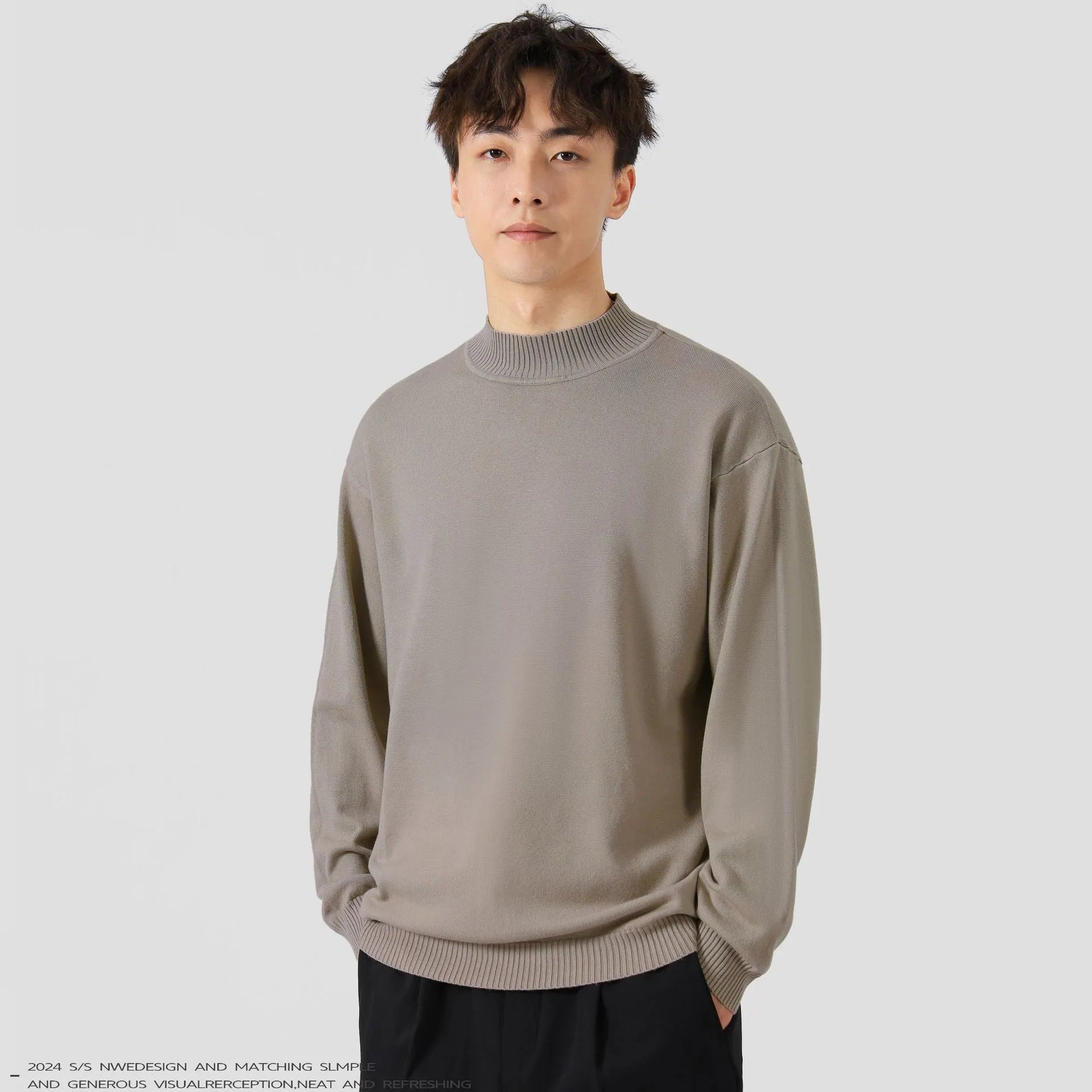 Men's solid colour loose long-sleeved pullover sweater on a hanger, shown in army green.