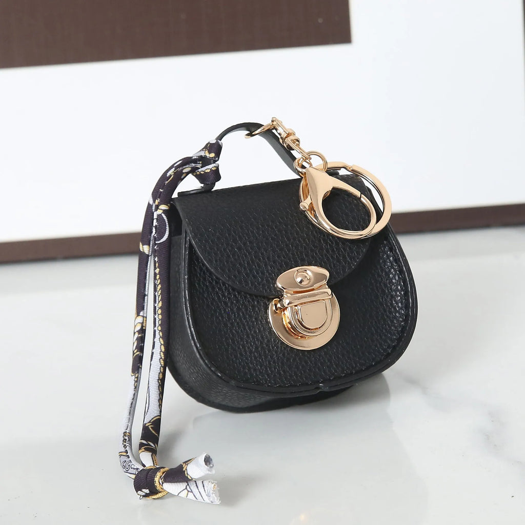 Solid colour PVC coin purse with keychain attachment in multiple colour options
