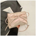Women's black crossbody underarm bag with horizontal square shape and sewing line detailing