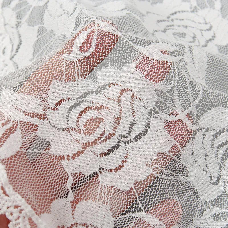 Round white wedding veil headpiece with floral design measuring 30cm in diameter