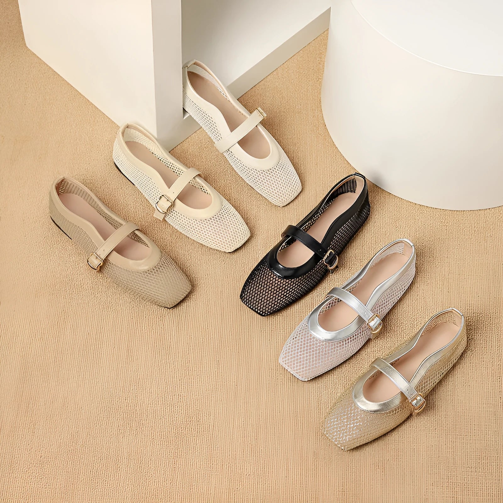 Women's beige mesh summer hiking pumps with a buckle and flat heel on a plain background.