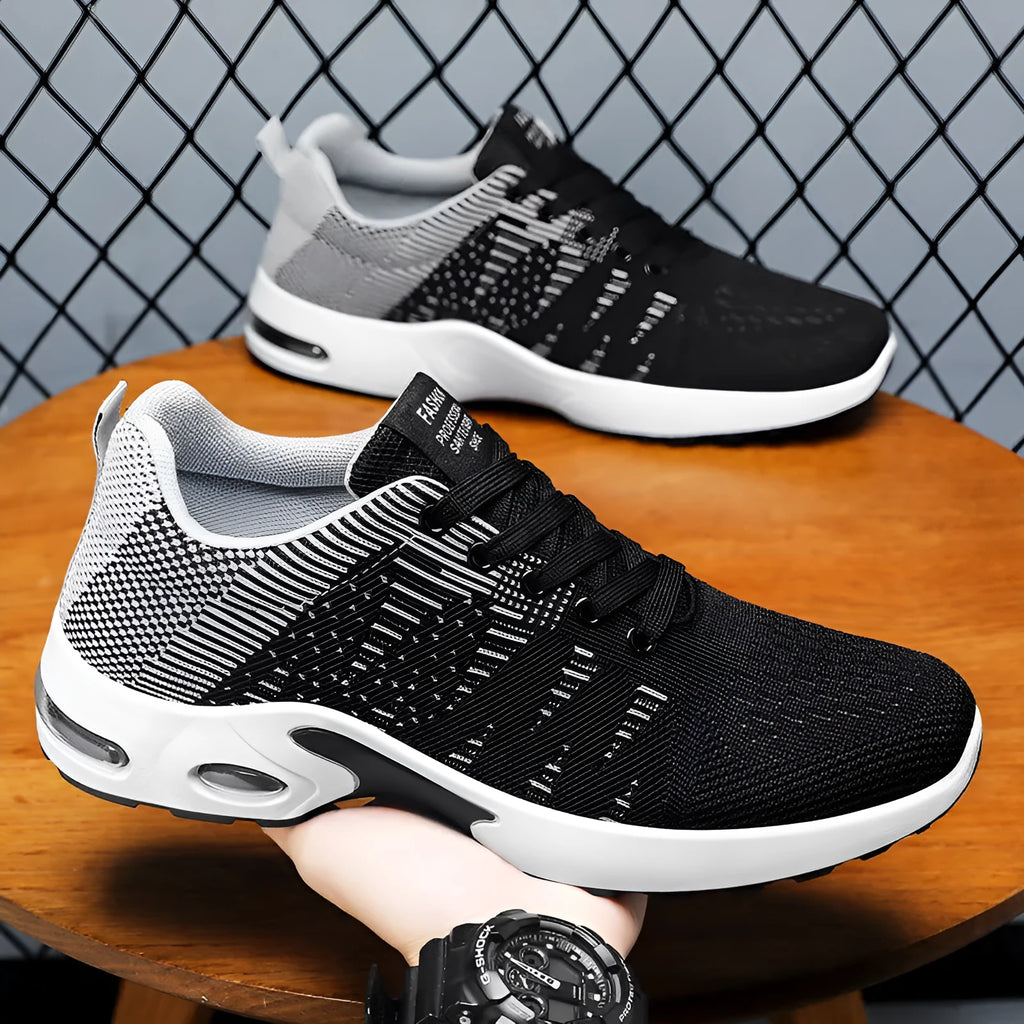 Men's black and blue Flyknit mesh casual sneakers with lace-up front and soft sole.