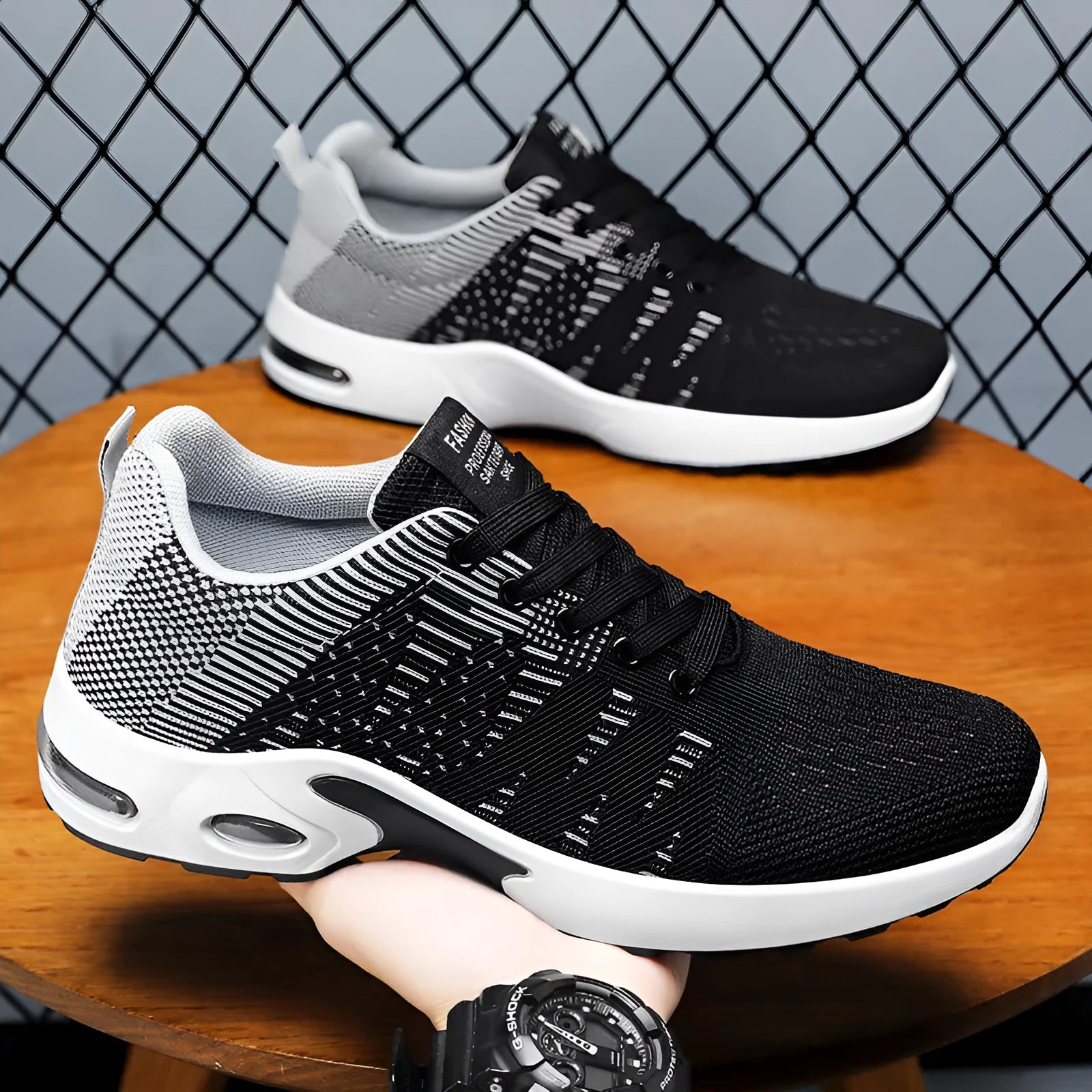 Men's black and blue Flyknit mesh casual sneakers with lace-up front and soft sole.
