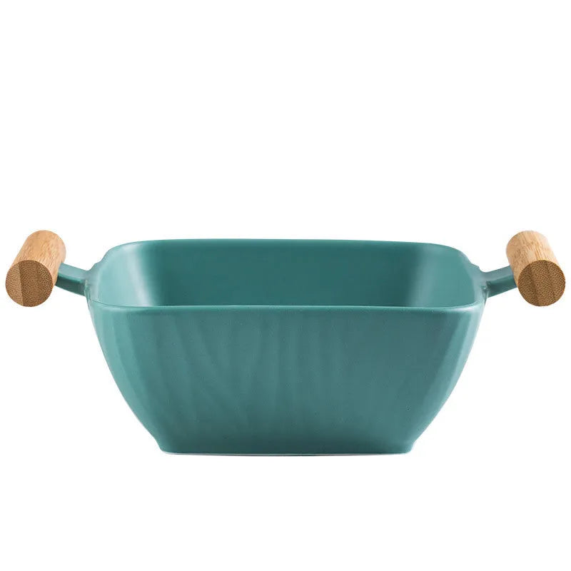 Ceramic serving bowl with lid in irregular modern shape, heat-resistant porcelain construction