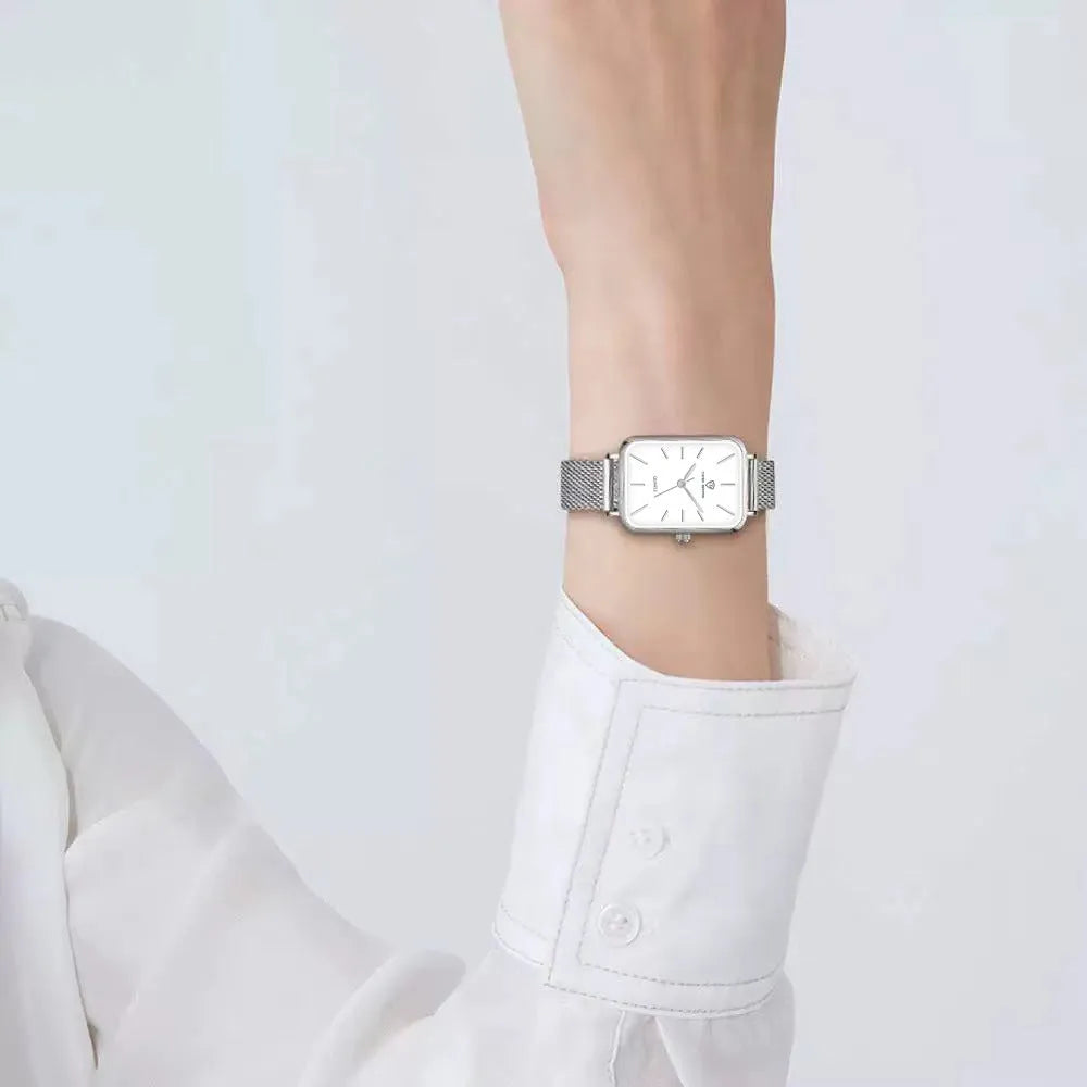 Women's waterproof quartz watch with rose gold finish, showing 34mm alloy case and woven steel strap