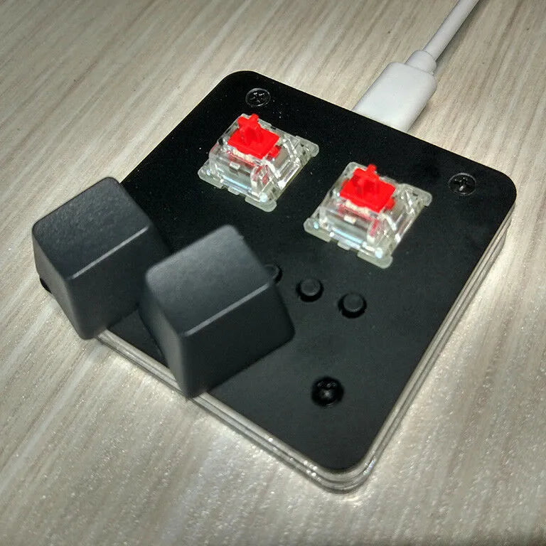 Compact plastic USB keyboard with multimedia keys in black, grey, pink, or white.