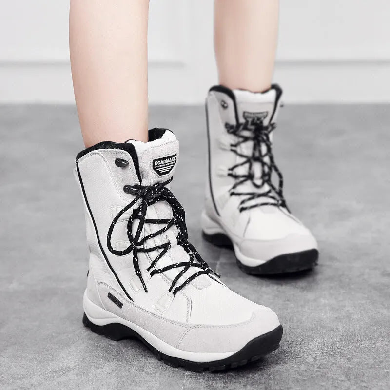 Women's mid-calf thermal snow boots in black with genuine leather upper and rubber sole for winter outdoor use