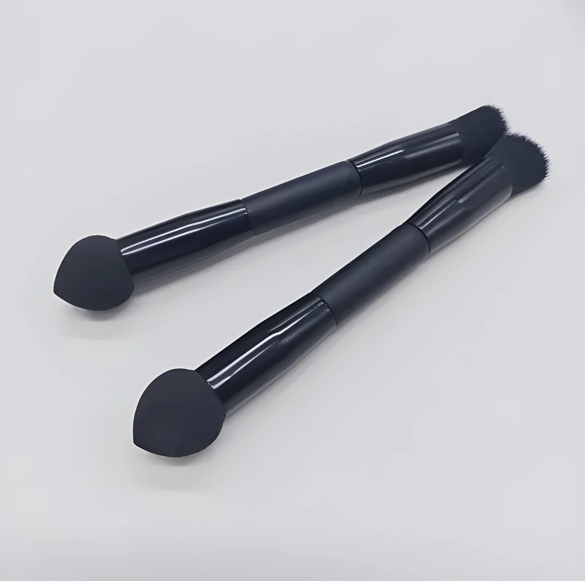Double-headed miter sponge concealer brush with black wooden handle