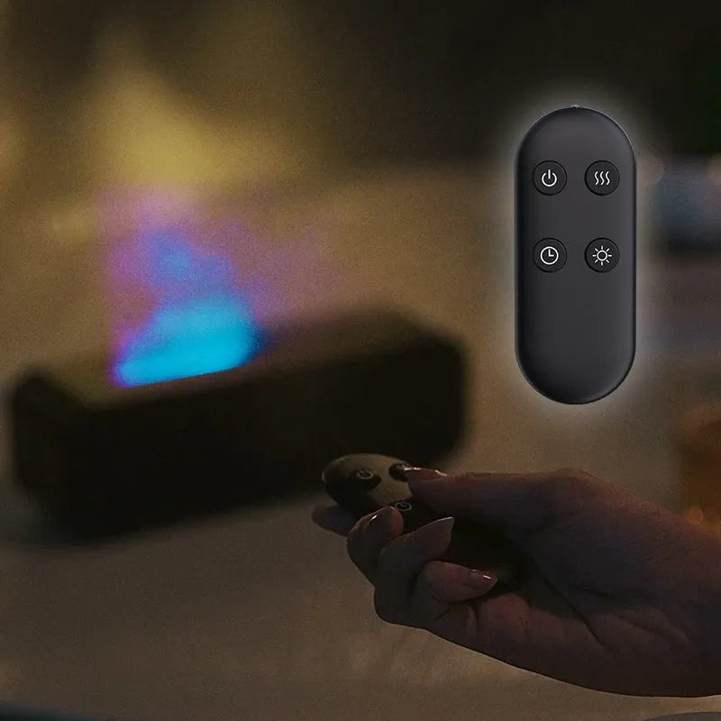 Black and white USB essential oil aroma diffuser with remote control and colour-changing flame light.