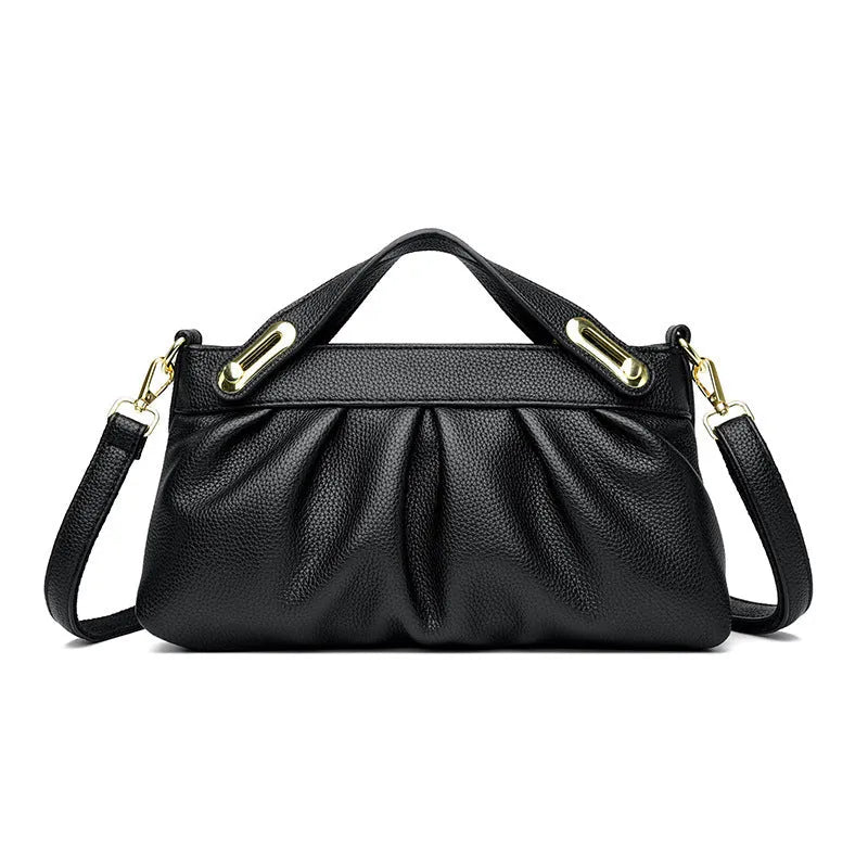 Leather niche pleated shoulder crossbody bag in black with horizontal square shape, multiple interior pockets and soft composite leather.
