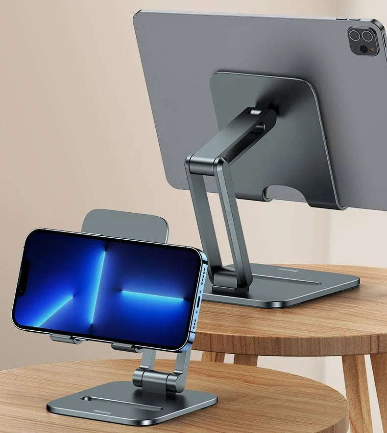Deep space grey aluminium folding stand holding a tablet and a mobile phone on a desk.