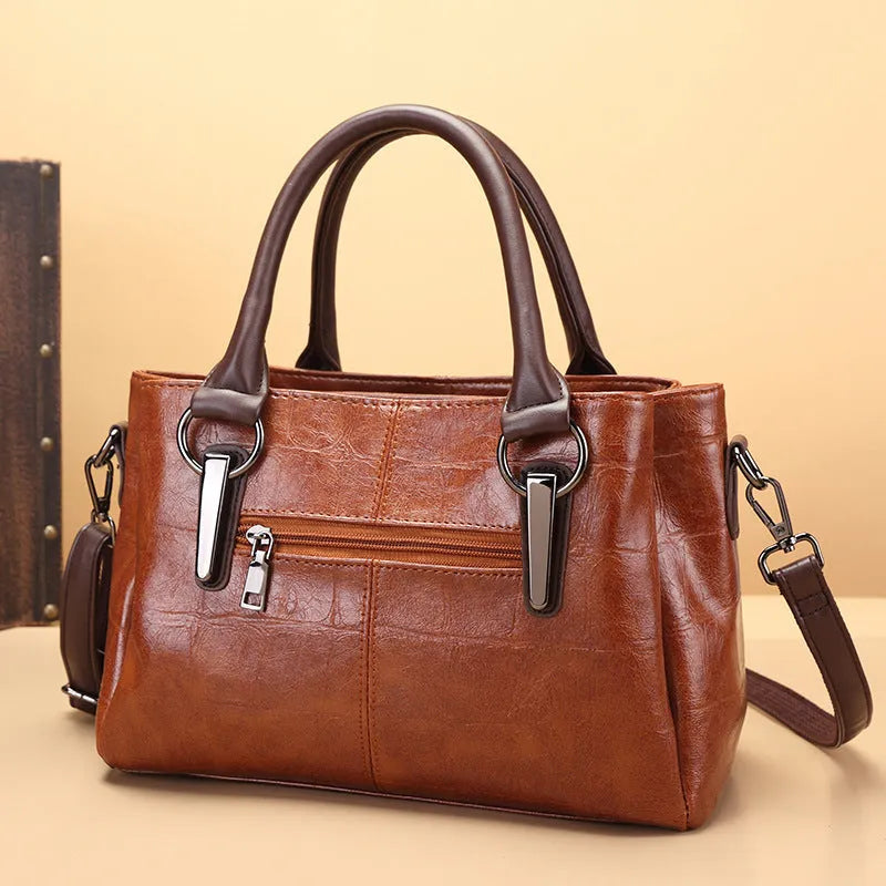 Large capacity shoulder bag with urban simplicity style, showing internal zipper compartments and contrasting sewing thread details