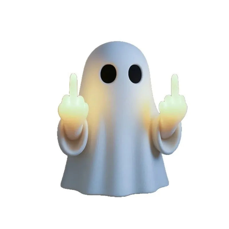 White ghost-shaped night lamp on table with soft glow, measuring 19.85cm tall for Halloween decor