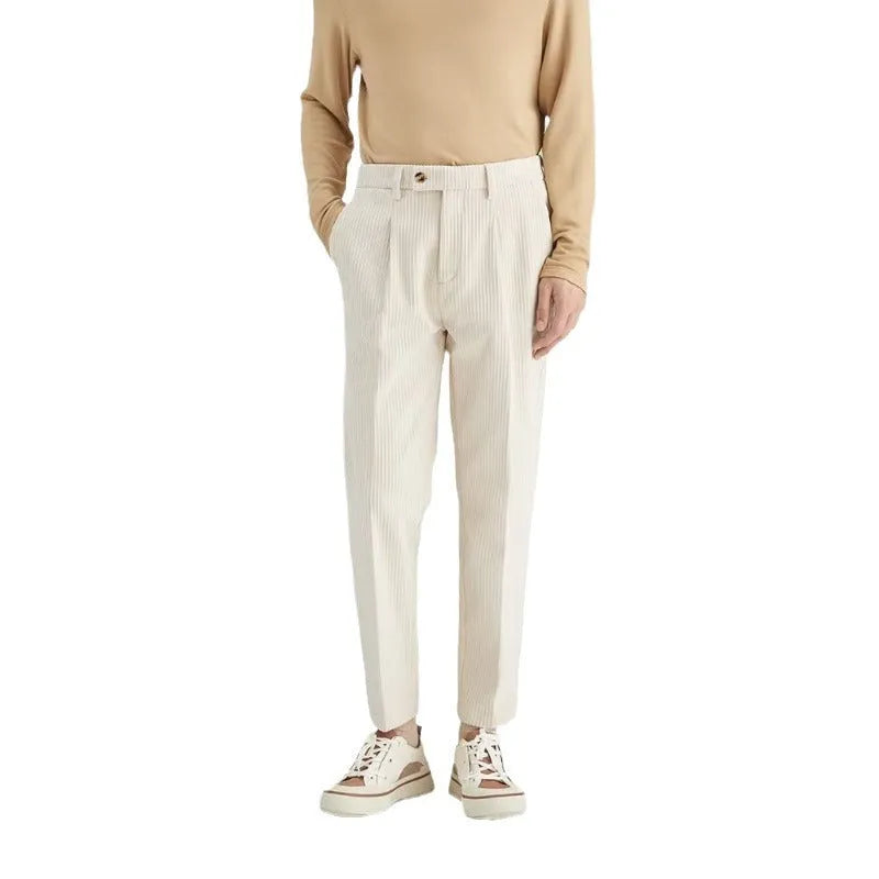Men's beige straight-leg corduroy trousers with a mid waist and micro elasticity, laid flat.