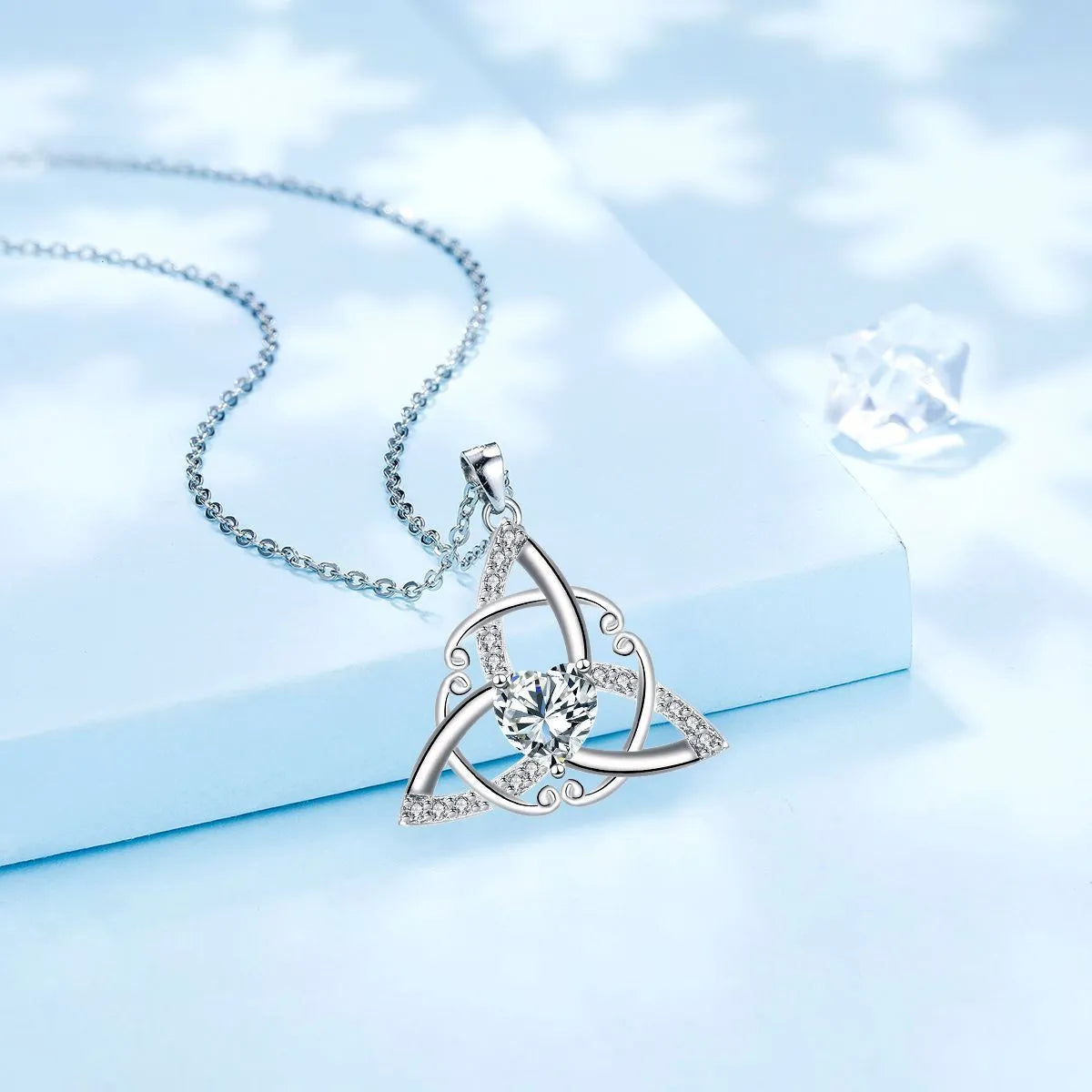 A geometry-shaped Celtic knot pendant necklace for women in an electroplated copper finish.