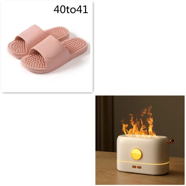 Black USB humidifier with flame simulation effect on wooden desk, showing mist output and compact 15cm height