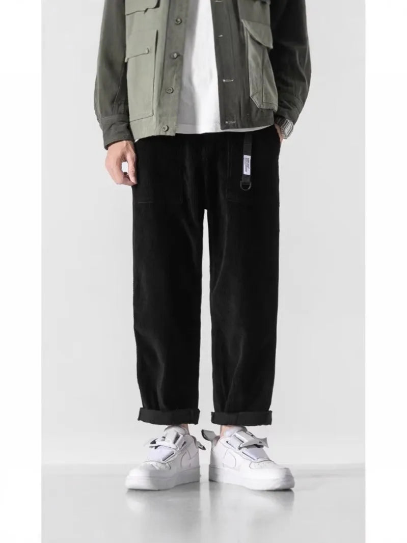 Loose straight tapered pants in dark grey, black, or khaki with wide legs and straight-leg opening