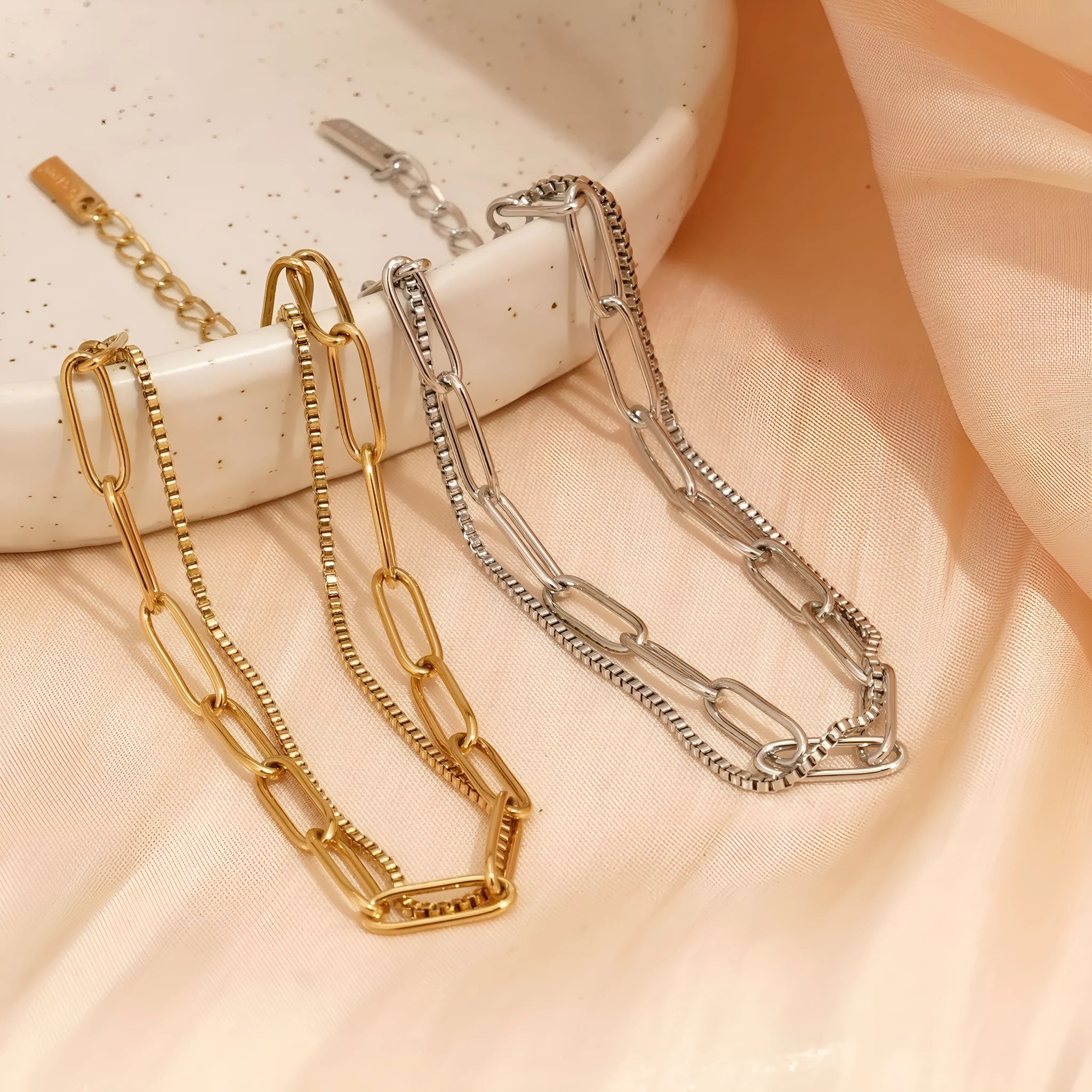 Double layer twin stainless steel bracelet in gold or silver with geometric line design.