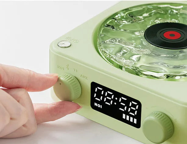 Retro-style Bluetooth speaker with rotating vinyl turntable and RGB coloured lighting effects