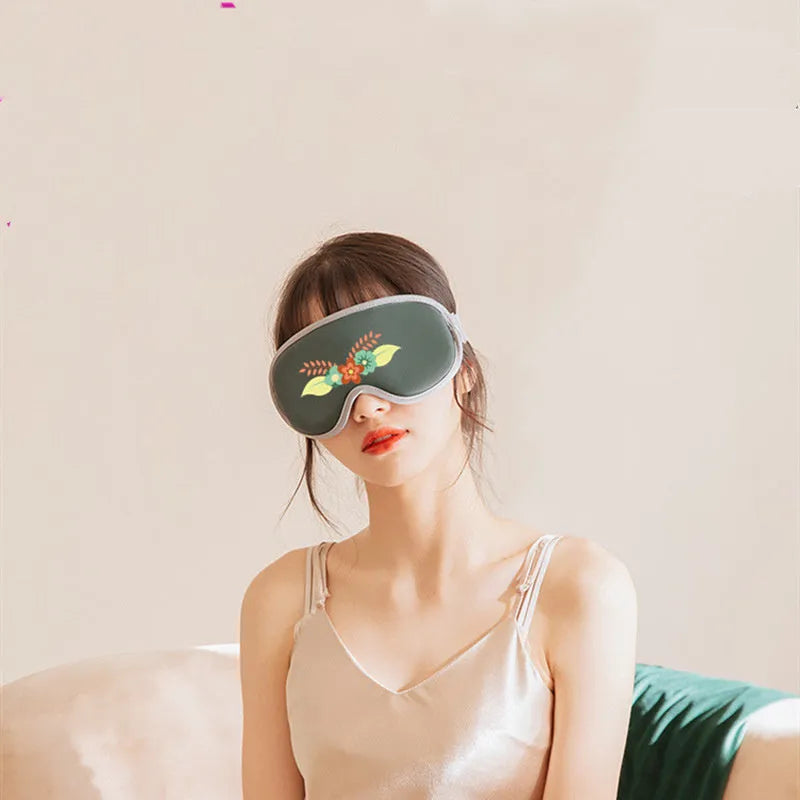 Portable eye SPA mask in green or pink with adjustable heating and vibration settings, showing 93mm by 200mm size