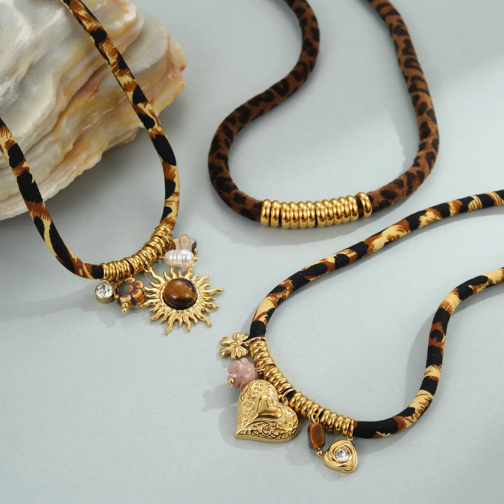 Gold geometric leopard series pendant on an adjustable stainless steel necklace chain.