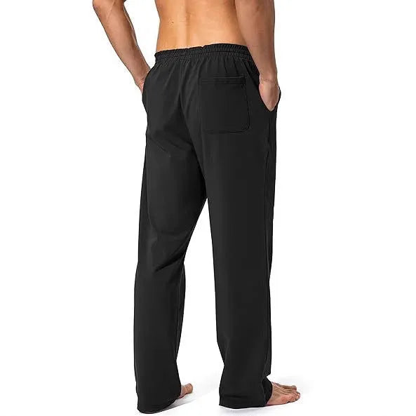 Men's loose-fitting grey casual trousers made from quick-drying polyester fabric.
