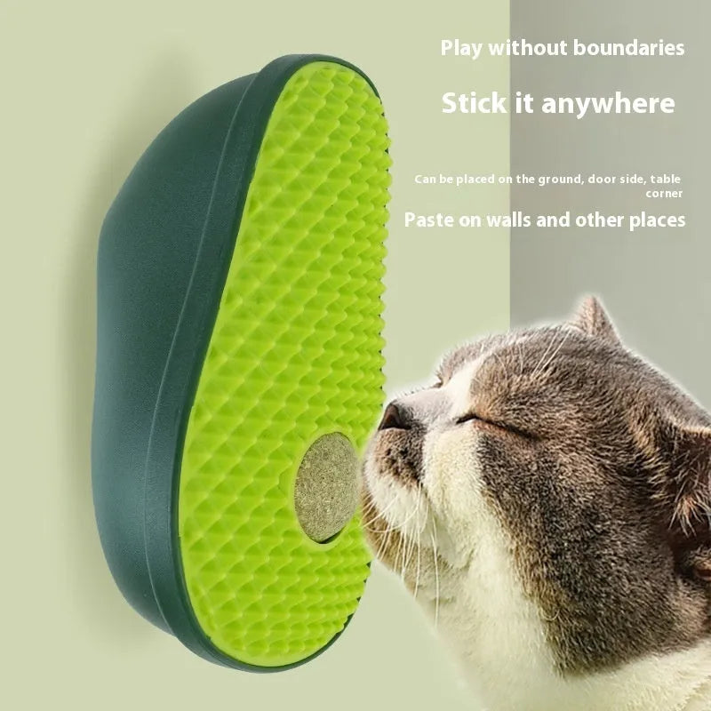 Green avocado-shaped cat scratching toy with textured posts on a white background