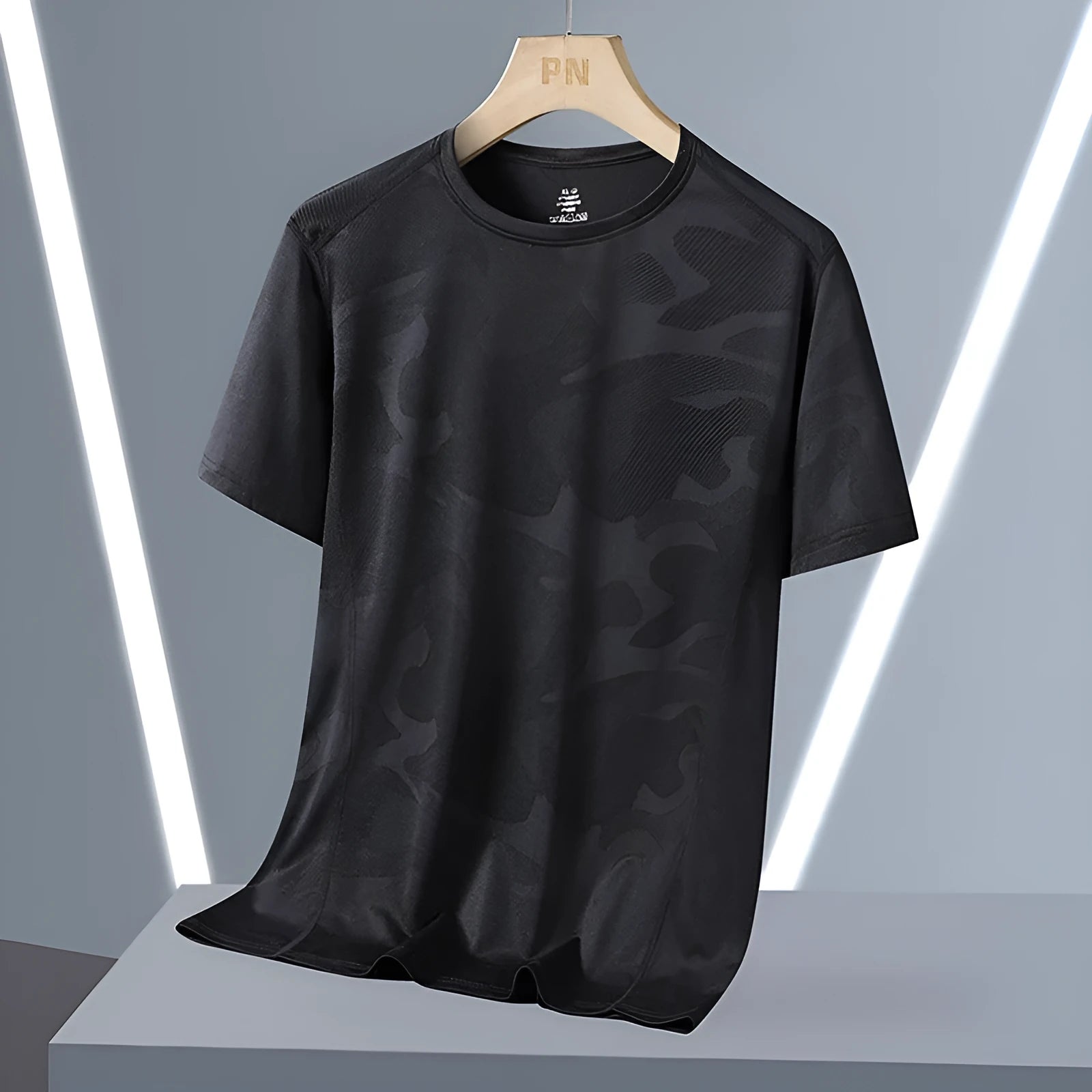 Men's loose fit camouflage short sleeve summer top in quick-drying nylon fabric.