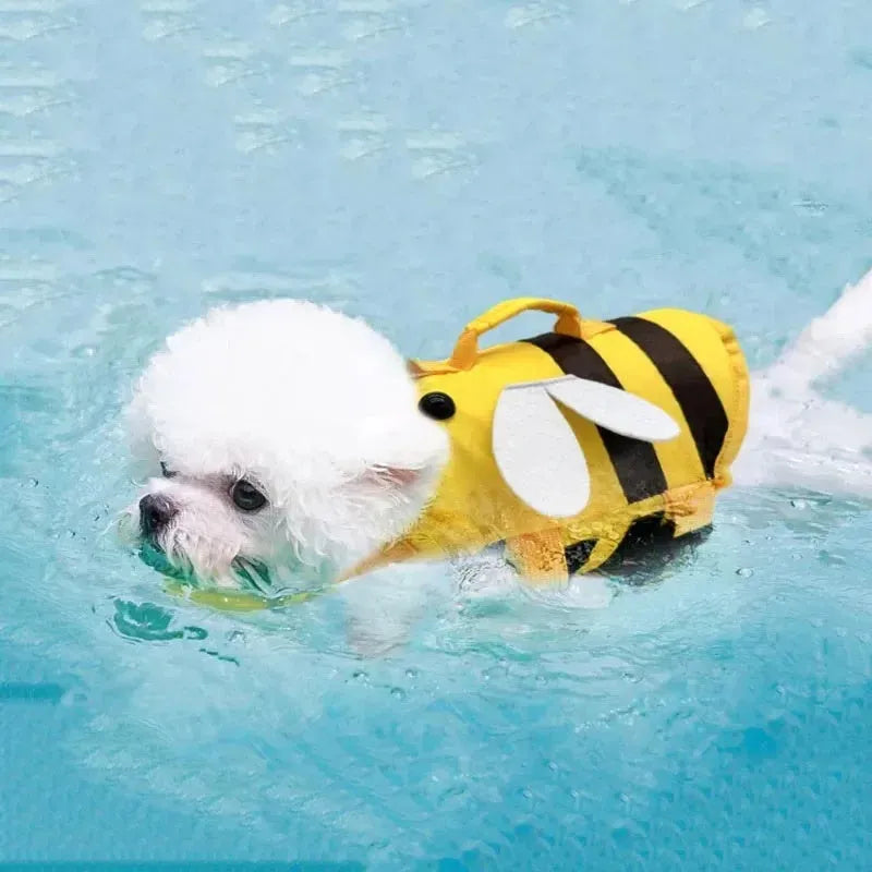 Green dog life vest with reflective strips and a D-ring handle on the back, shown fitted on a dog.