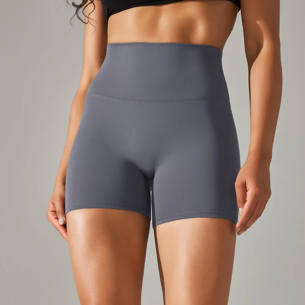 Women's high waist hip lift fitness tights in dark green, shown for sports and casual wear.