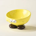 Blue slanted ceramic pet bowl for cats and dogs on a plain background.