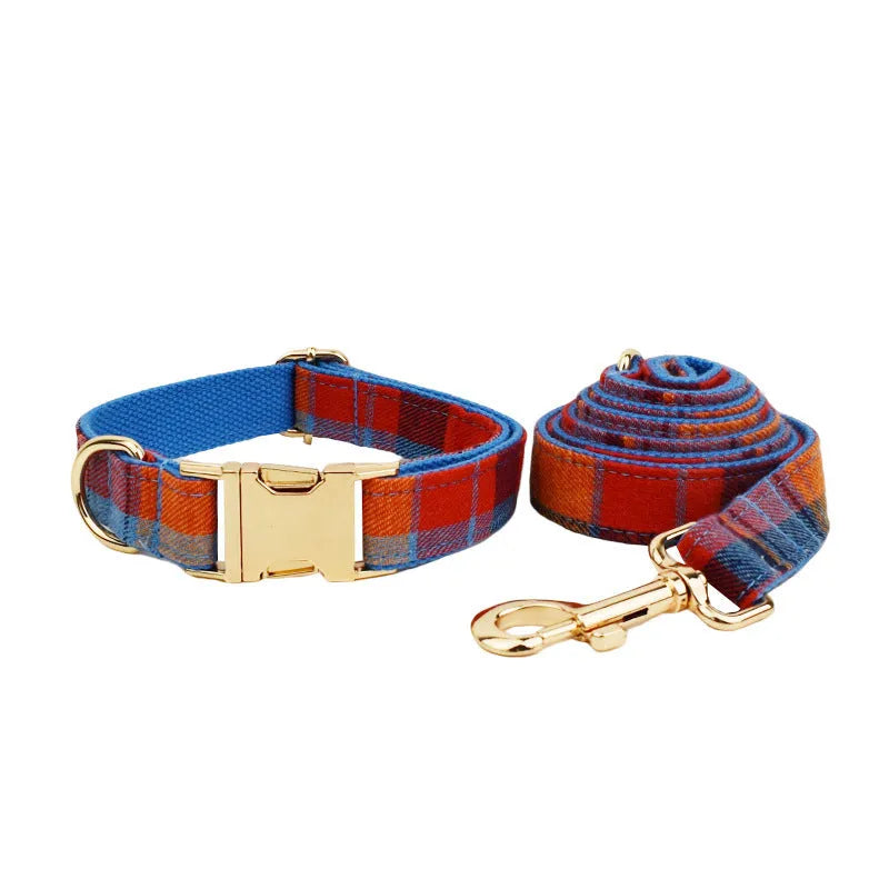Blue velvet plaid pattern dog collar and matching hand-holding rope leash on a white background.