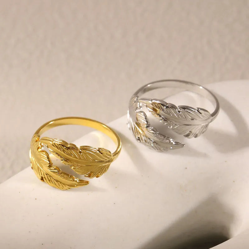 Women's adjustable opening feather fashion ring in silver or gold colour on titanium steel.