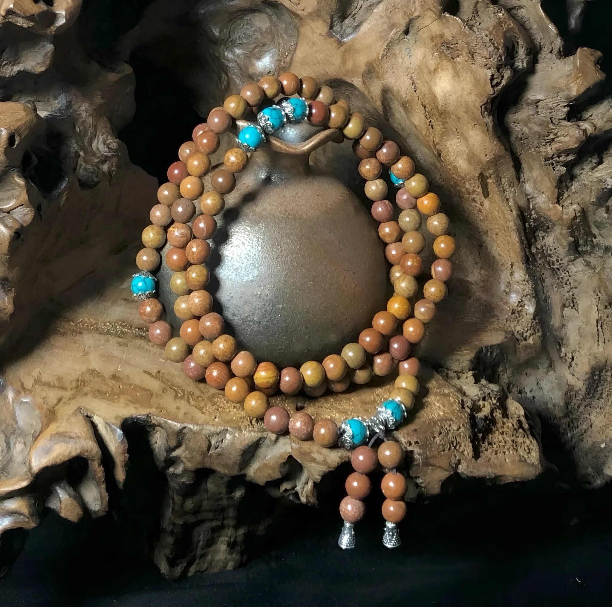 Handmade geometric stone bead bracelet with 108 polished beads in natural colour