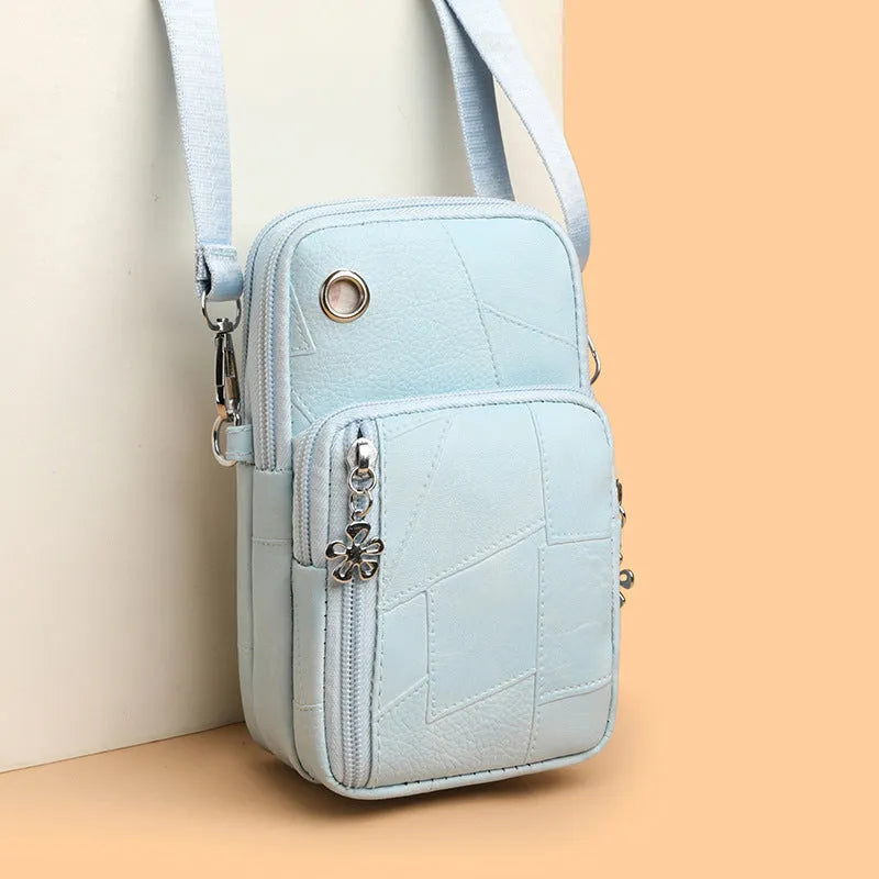 Mini vertical phone crossbody bag in PU leather with sandwich pockets, shown in available colours