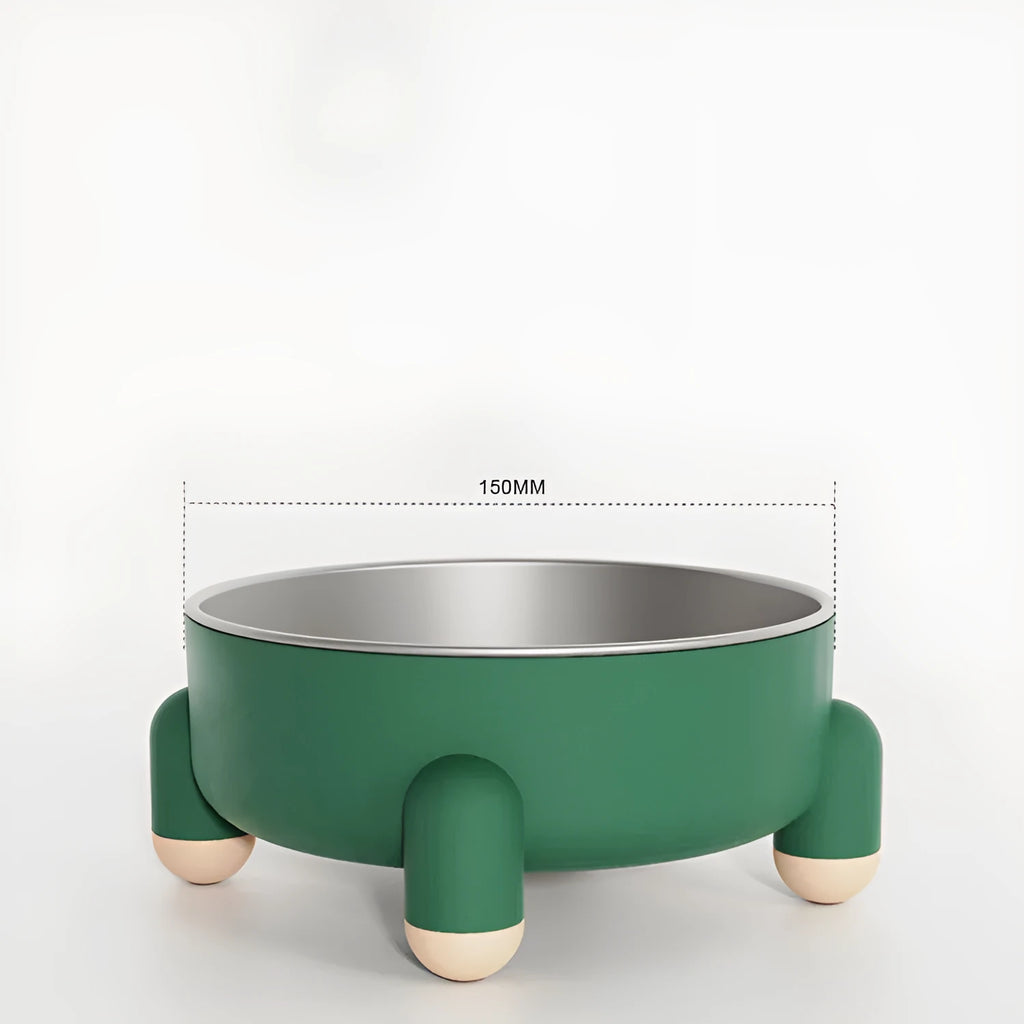 Green stainless steel pet bowl with non-slip base and high foot on a wooden floor.