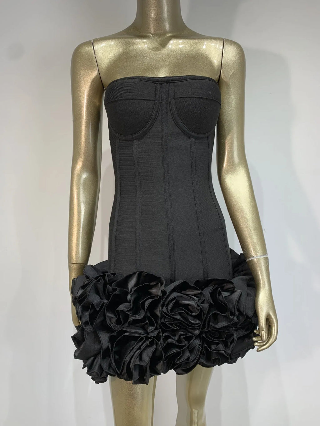 A women's solid colour polyester dress with a mid-waist in red, white, or black.