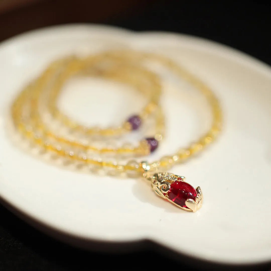 Natural Brazil gold rutilated quartz bracelet with three gold circles and ruby accents in Chinese-style design