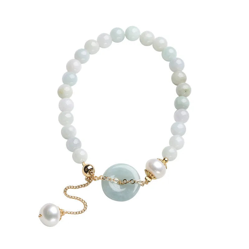 Handcrafted jade pearl bracelet with adjustable peace buckle closure and geometric design elements