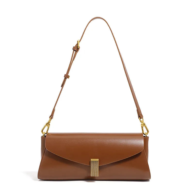 Milky white cowhide leather women's crossbody bag showing clamshell opening and pillow shape.