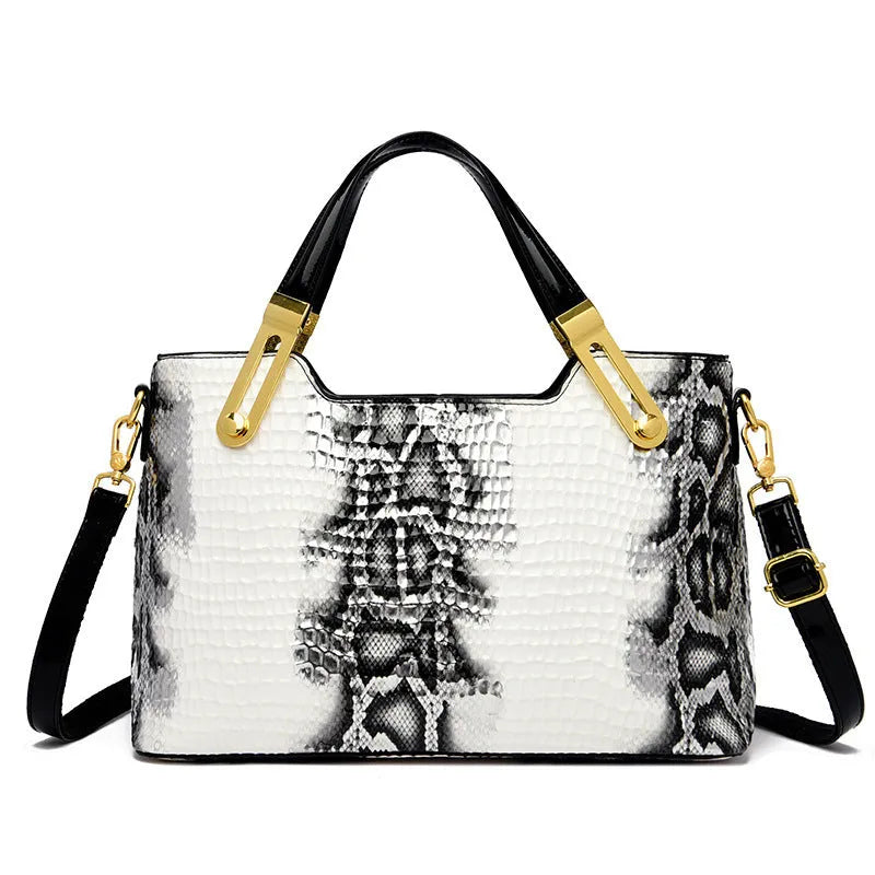 Black retro style messenger bag with chain detail showing internal phone pocket and file compartment