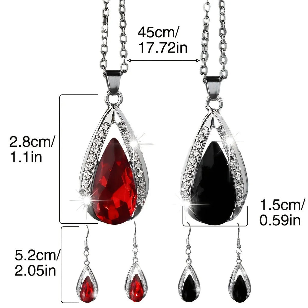 Black and red teardrop glass pendant necklace with matching earrings set on display