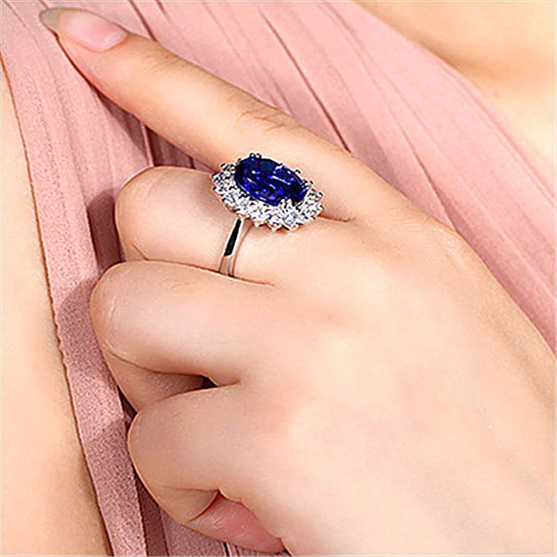 Adjustable opening geometric rhinestone ring in platinum-colour white copper with tanzanite sapphire stones