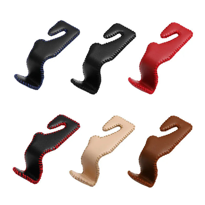 Gold-coloured stainless steel car seat back hook for organising bags on vehicle headrests.