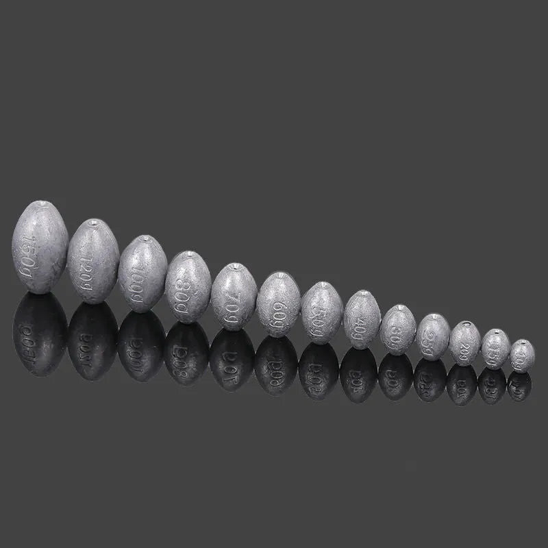 Rugby-shaped fishing sinker with scale texture, electrolytic lead construction, plastic core, 4cm length