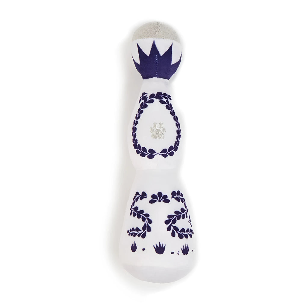 Red and white tequila bottle plush dog toy with squeaker for playful chewing and fetch games