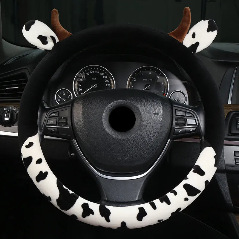 Black short plush steering wheel cover with protective handle grip on car steering wheel