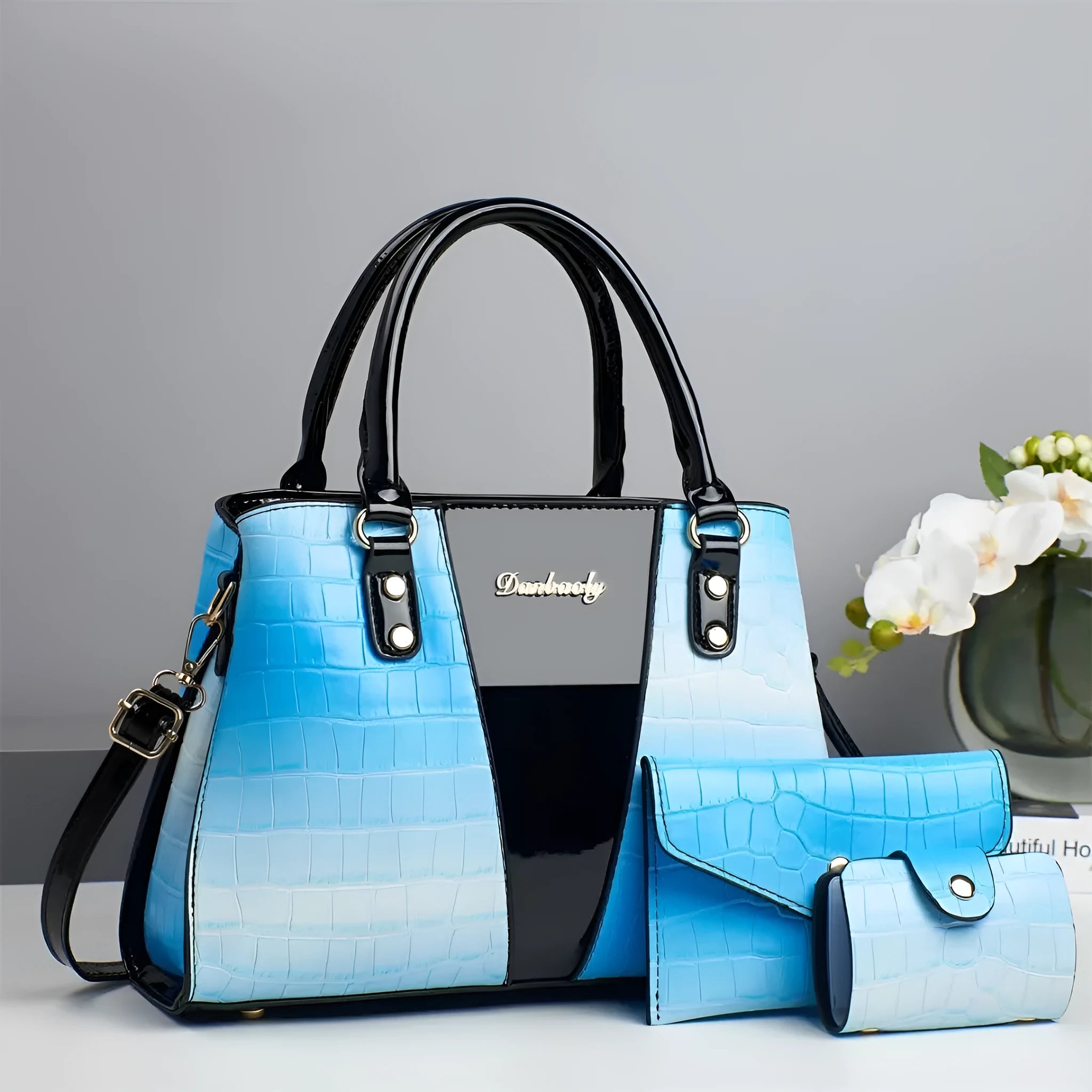 Three-piece ladies' PU leather shoulder bag set with crocodile stitching in beige colour.