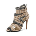 Women's denim high heel sandal with strappy design and 4-inch wedge heel, shown in plaid print.